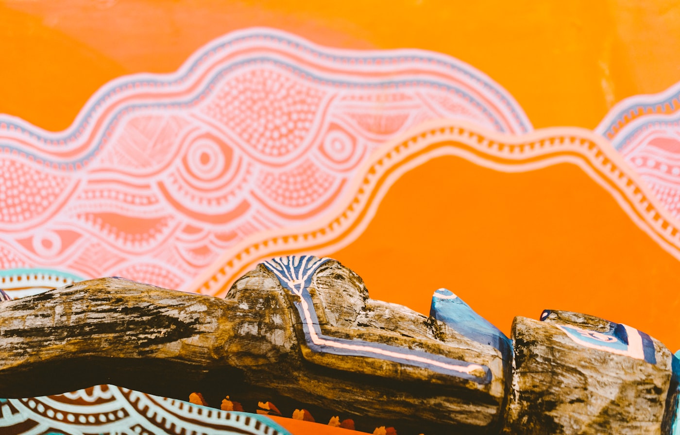 Aboriginal dot-style artwork in warm ochre tones