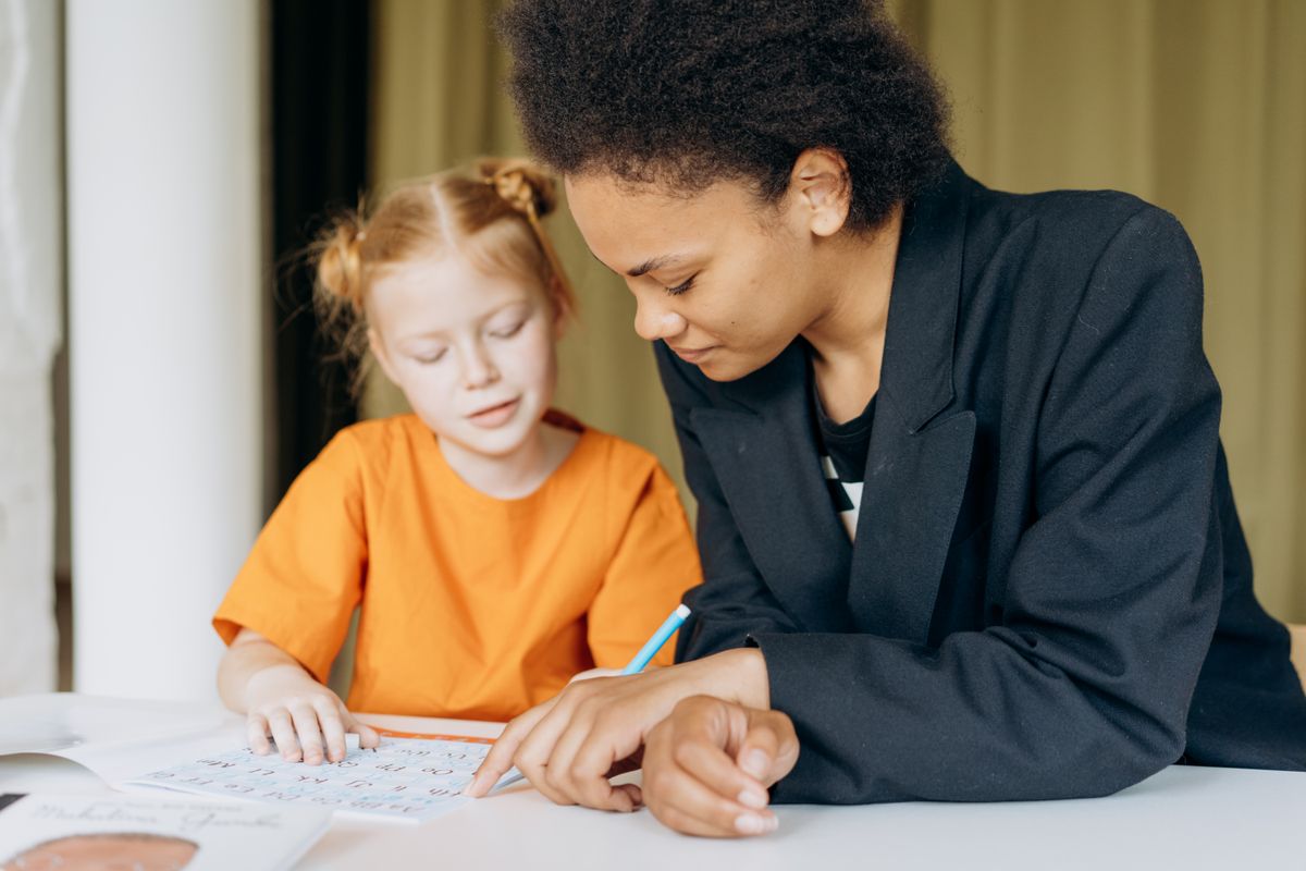Educator supporting a child one on one